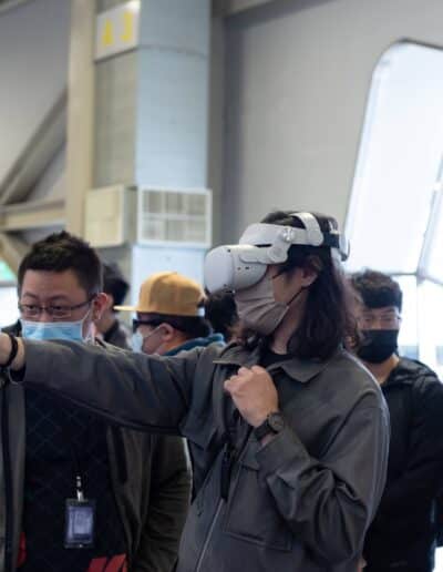 a girl playing vr device in G-EIGHT game show